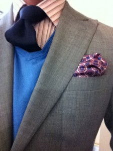 Image Consultant demonstrating color mixing with a custom suit and pocket square 