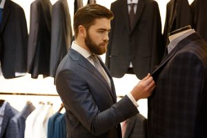 Man buying a suit in a store