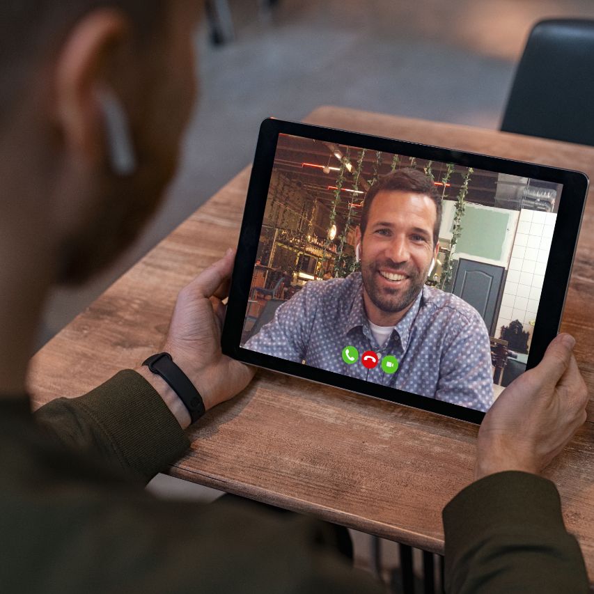 man making video call on tablet