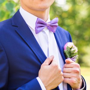 purple pretied bow tie on young man