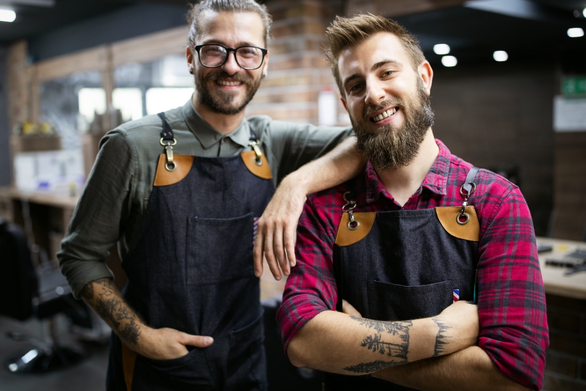 two men with beards in aprons