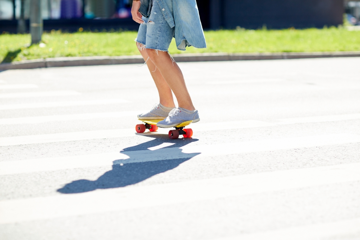 young man skateboarding wearing shorts
