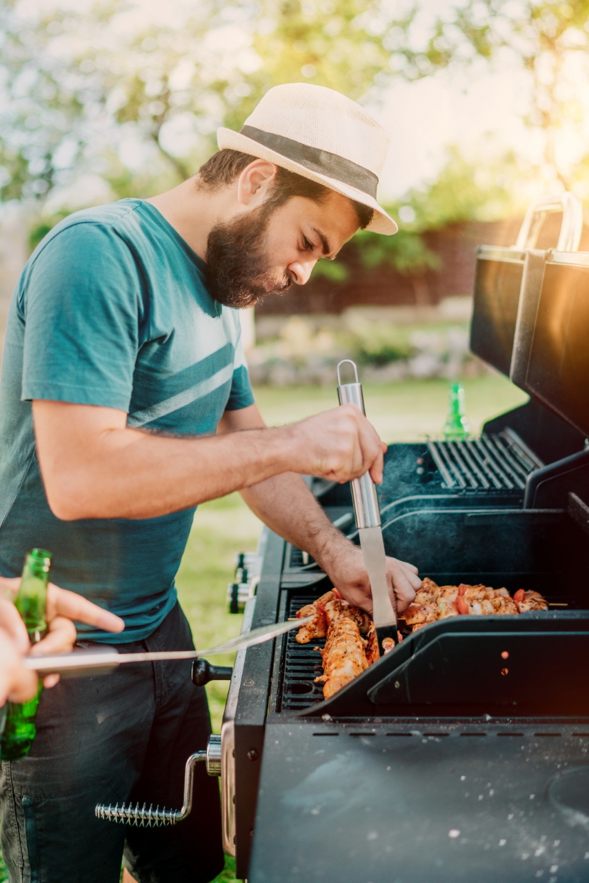 man with beard grills on 4th of july