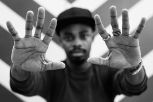 black man showing rings on his hands