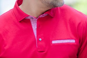 contrast pocket on red polo shirt