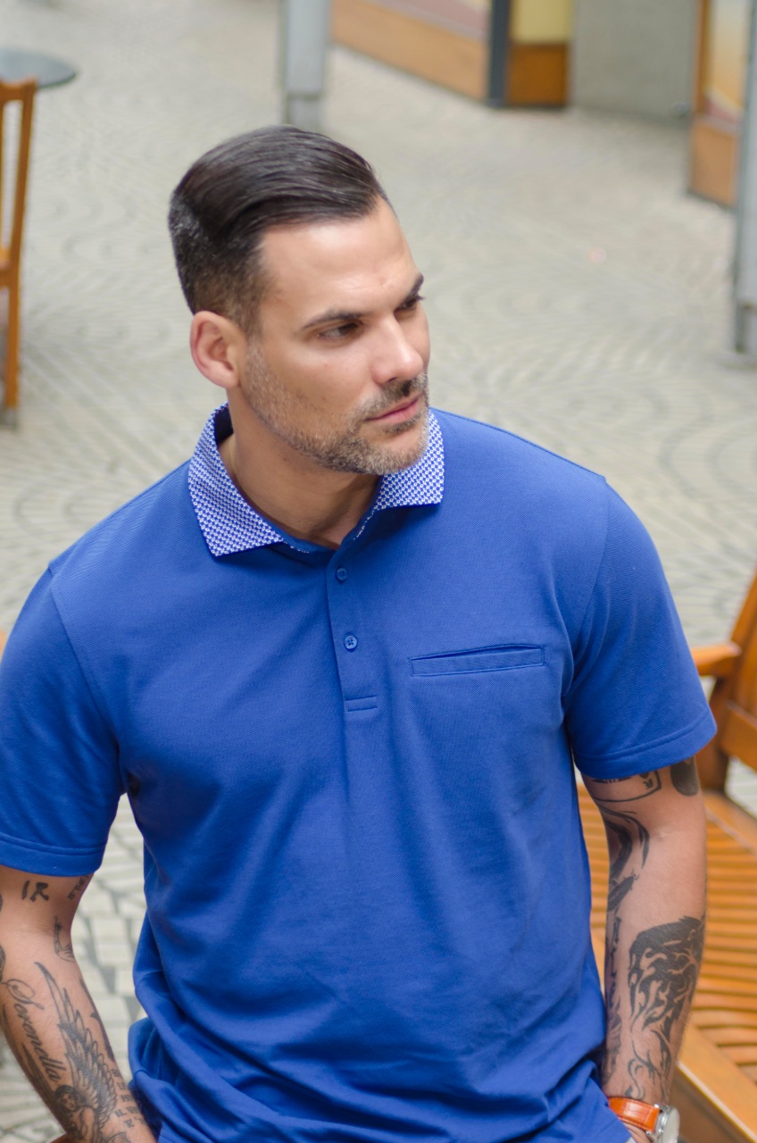 man in blue short sleeve custom polo