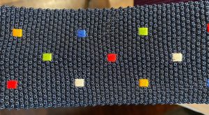 blue silk knit tie with multi-colored square pattern