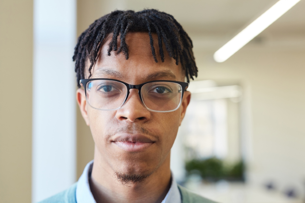 young black man in browline glasses