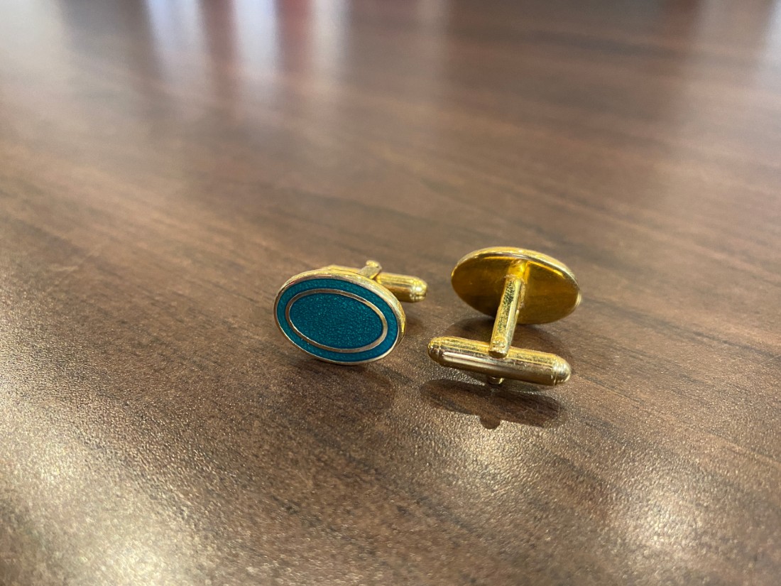 gold cufflinks with green face