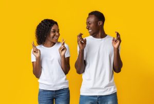 young black couple making same hand gesture