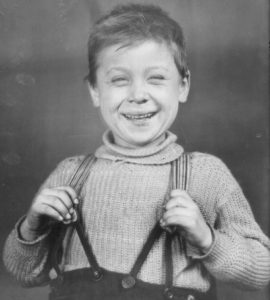 young boy wearing suspenders
