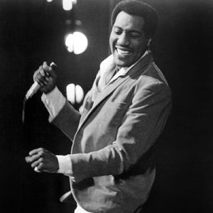 otis redding on stage in a suit