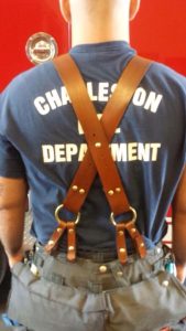 fireman wears x back suspenders