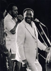 Muddy Waters in a light suit