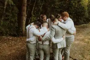 Men in a group in suspenders