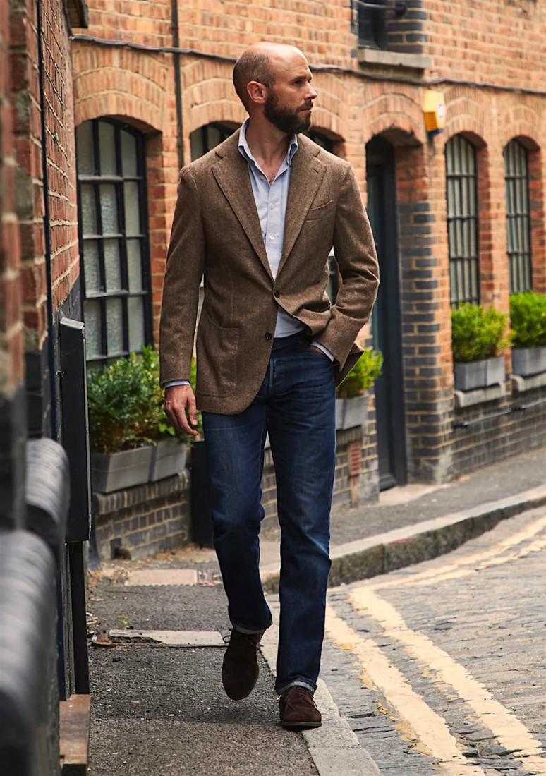 man in brown sport jacket and custom jeans