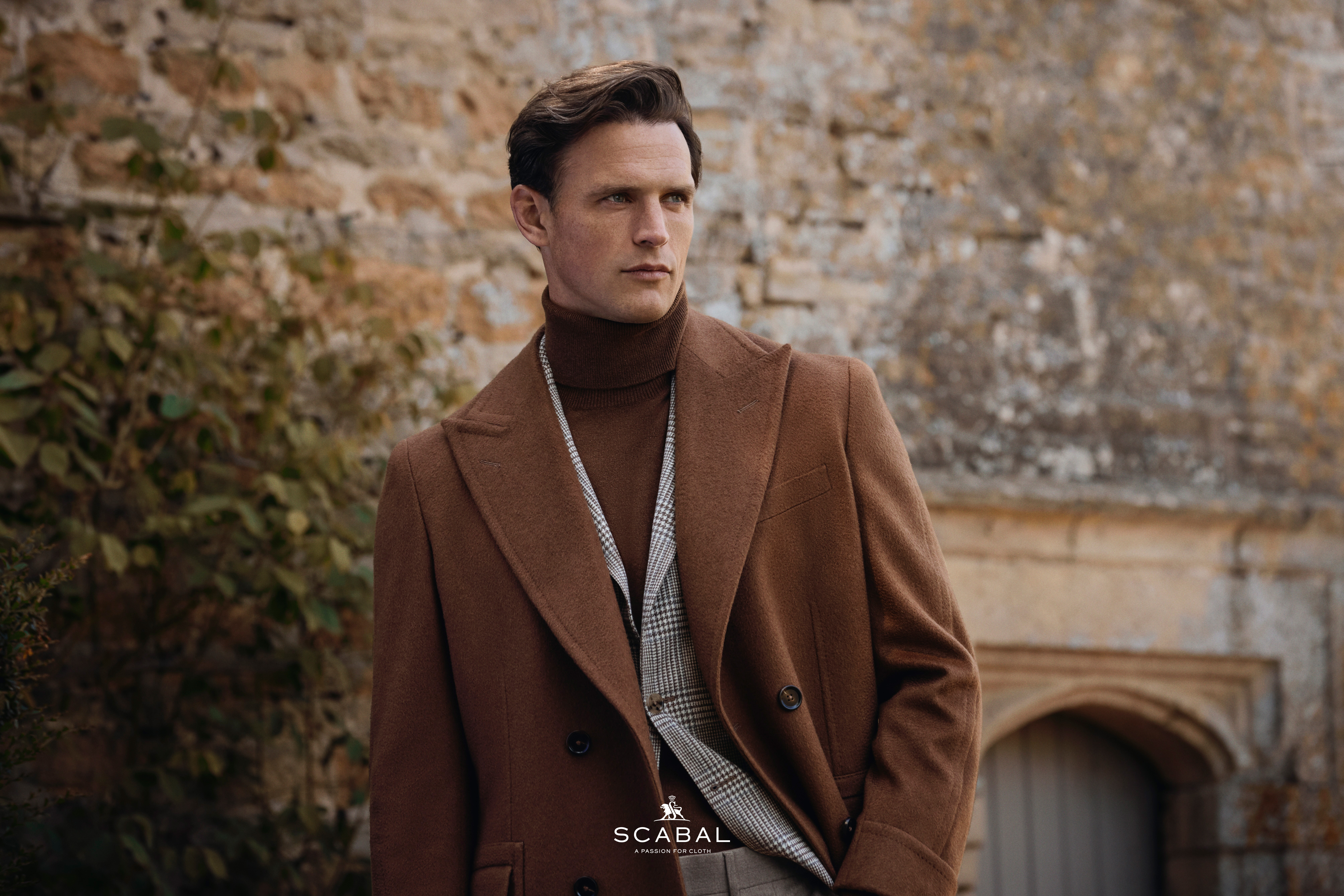 well dressed man in an overcoat